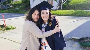 Blair with her mom before graduation.