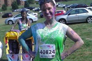 Kelly Ayers covered in paint after running a 5K.
