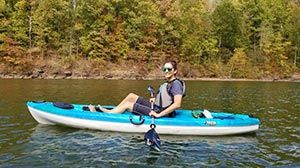 Brady on a lake in a kayak.