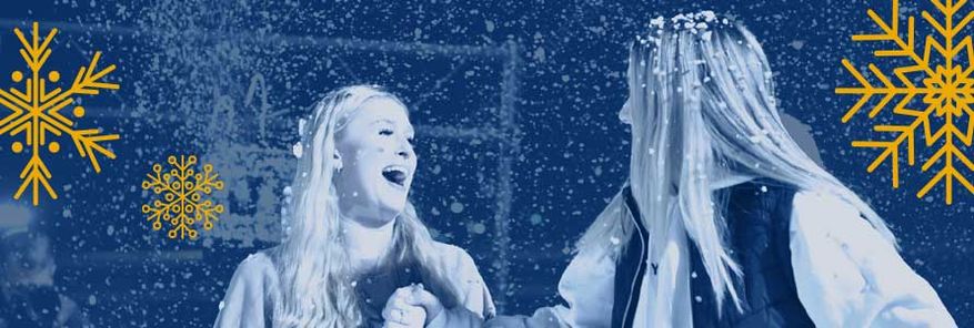 Two female students in the snow.