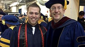 Chris Morlock in his cap and gown at graduation.