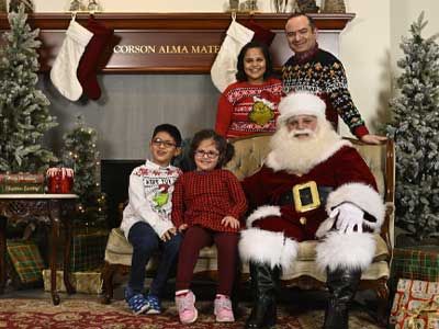 Shipra Gupta and her family take a Christmas photo with Santa.