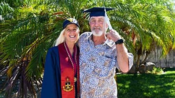 Jill and her husband at graduation.